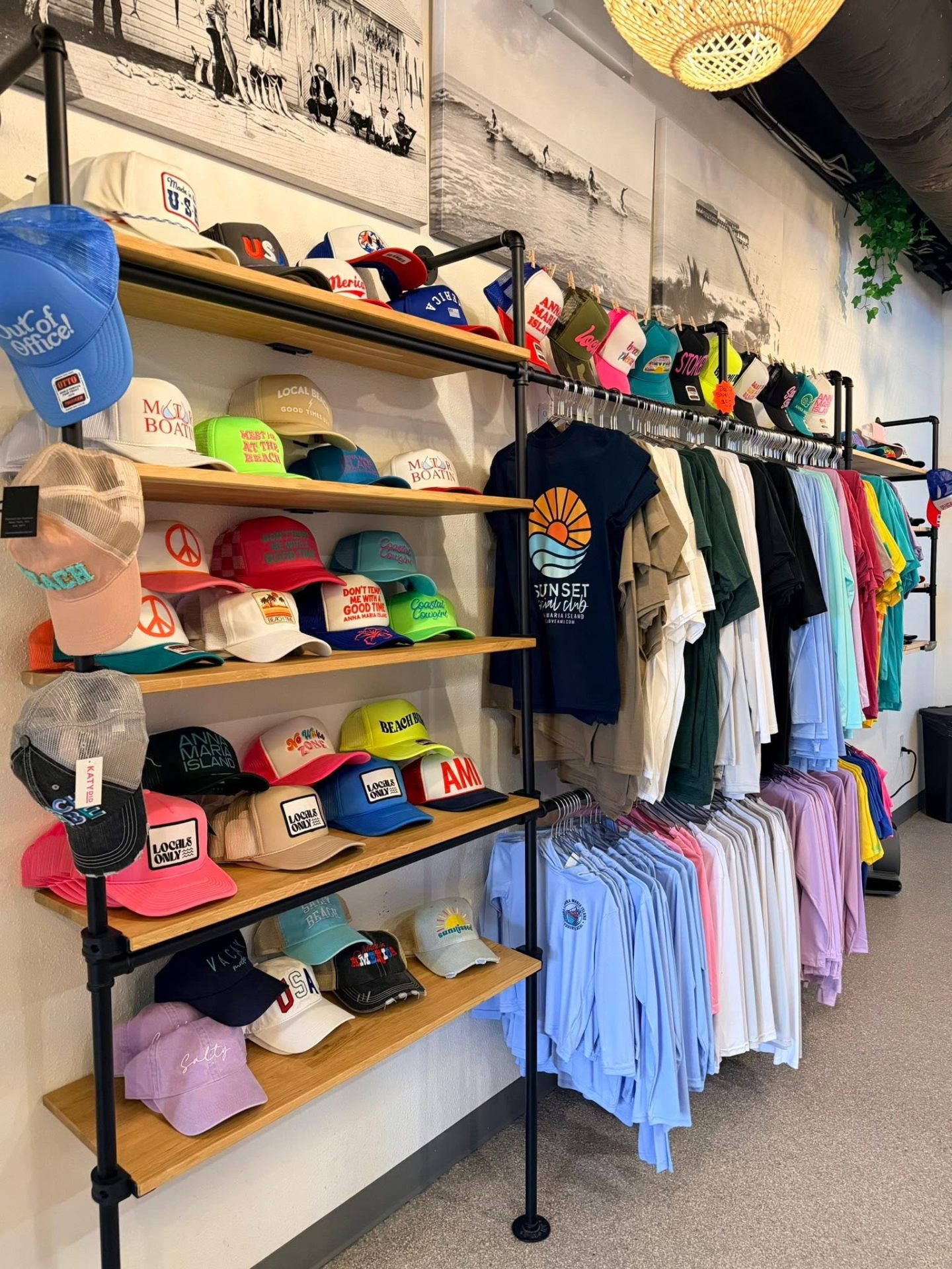Trucker hats and beach tees inside the AMI FroYo shop