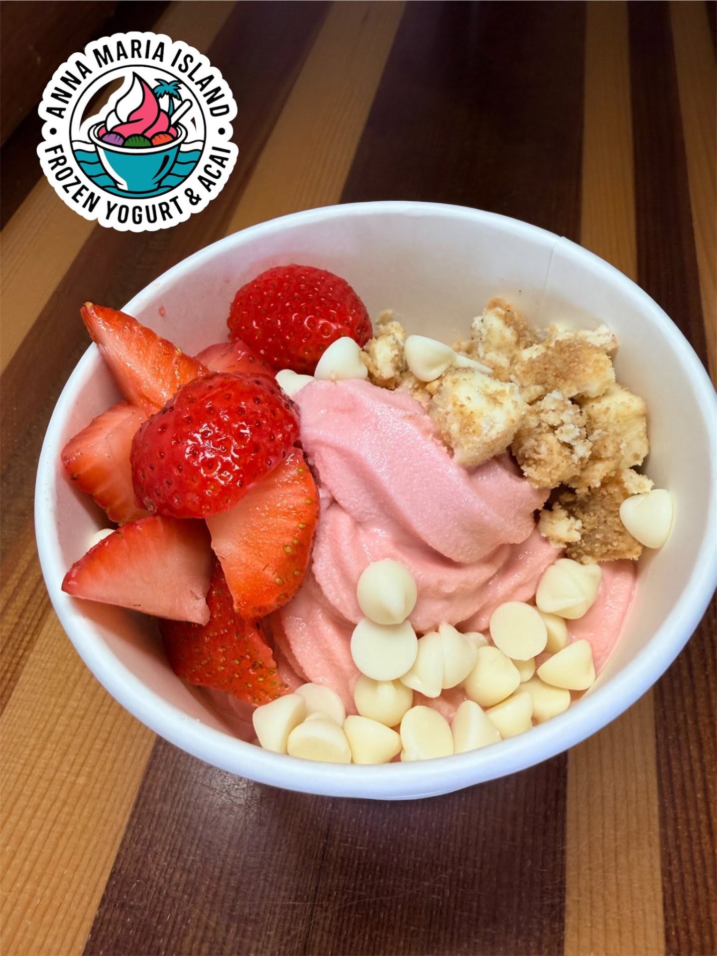 Three açaí with strawberries, banana, nutella and peanut butter drizzles